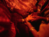 Hand of Bride Being Held by Female Relatives During Wedding Ceremony  India