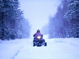 Snowmobile Driving Through Forest  Finland