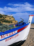 Traditional Painted Fishing Boat on Beach  Albufeira  Algarve  Portugal 