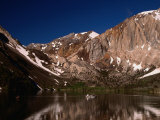 Lone Fisherman on Convict Lake Surrounded by Mountains  California  USA