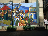 Woman Leaning Against a Wall with Mural in Old Havana  Havana  Cuba