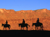 Silhouette of Mule Riders on Trail Riding Through Professor Valley  Moab  Utah  USA