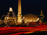 Illuminated Ancient Egyptian Obelisk and Fountain in Place De La Concorde  Paris  France