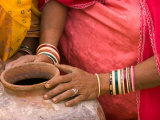 Woman's Hands on a Pottery Jug for Carrying Water  Thar Desert  Jaisalmer  Rajasthan  India