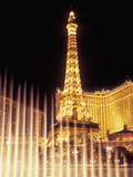 Paris Hotel and Casino's Eiffel Tower with the Bellagio Water Fountain Show  Las Vegas  Nevada  USA