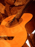 Double Exposure of Guitar and Rocks