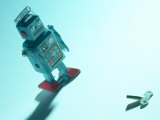 Gray Toy Plastic Robot Walking Towards Key Mechanism