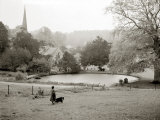 A Woman Walking Her Border Collie Dog in the Countryside