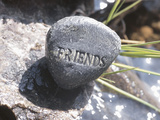 Rock with the Word Friends Beside Water
