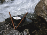 Sushi and Chopsticks Beside Rushing Water