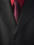 Businessman Wearing Red Shirt and Tie Under Black Suit