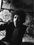Jimi Hendrix World Famous Guitarist  Sitting Bed