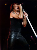 Jon Bon Jovi for Bon Jovi Group on Stage Singing into Microphone