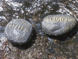 Rocks with the Words Imagine and Create in Water