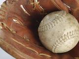 Beaten-Up Baseball in Baseball Glove