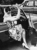 Girl in a Flower Print Dress  High Heels  Headscarf and Sunglasses Steps out of a Convertible Car
