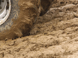 Tire Churning Through Mud