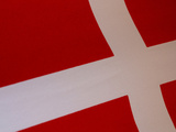 Close-up of the Denmark Flag with a White Cross on Red Fabric