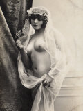 A Young Woman Posing Naked: a Veil Covers Her Hair and Comes Down Her Body
