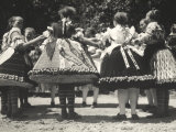 Traditional Dance Scene with Ladies Wearing Hungarian Traditional Dresses