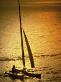 Silhouette of a Sailboat in the Sea