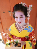 Eating Sushi  Apprentice Geisha (Maiko) Dressed in Kimono  Kyoto  Honshu  Japan