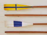 An Array of boat oars Mounted on a wall