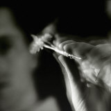 Blurred Image of a Man Aiming a Dart