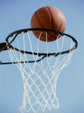 Close-up of a Basketball on The Edge of a Hoop