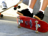 Close-up Image of Feet on Skateboards