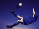 Soccer Player Kicking a Ball