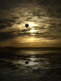 Silhouette of a Hot Air Balloon Over Water