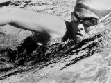 Woman Swimming in a Swimming Pool