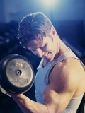 Young Man Exercising with Dumbbells