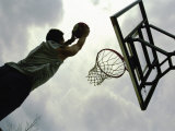 Low Angle View of a Man Shooting a Basket