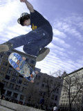 Skateboarder in Midair Doing a Trick