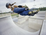 Teen Girl in Rollerblades on Ramp