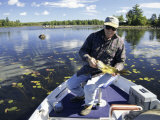 Senior Man Holding a Fish