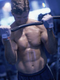 Young Man Exercising with Barbells