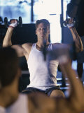 Young Man Exercising with Dumbbells