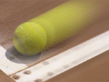 Blurred Image of a Tennis Ball Landing In Bounds