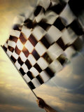 Person's Hand Waving a Checkered Flag