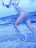 Side Profile of a Woman Running on the Beach