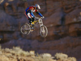 Side Profile of a Person on a Bicycle in Mid Air