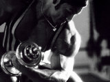Young Man Exercising with a Dumbbell
