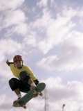 Low Angle View of a Young Man Skateboarding in Mid Air