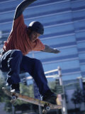 Young Man Skateboarding in Mid Air