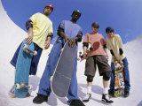 Low Angle View of a Group of Young Men Holding Skateboards