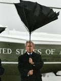 President Bush Jokingly Holds His Wind-Blown Umbrella Upright