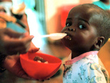 An Unidentified Baby is Fed at a Home for Hiv/Aids and Abandoned Children